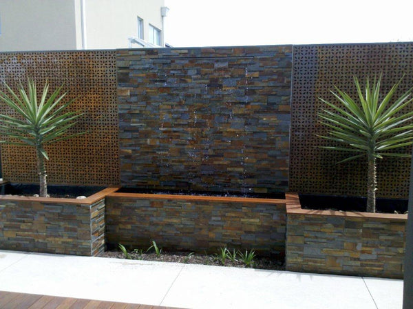 Stacked stone pool water feature